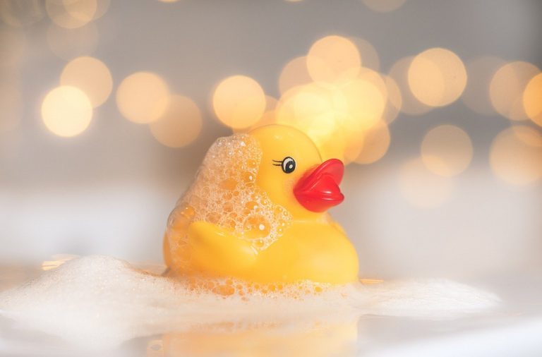 Photo of rubber duck in a bubble bath